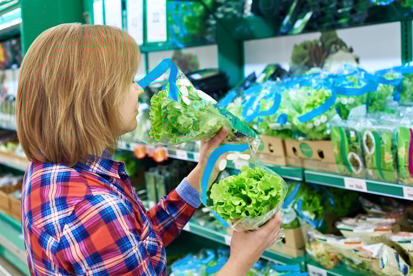 Woman smelling green leaf