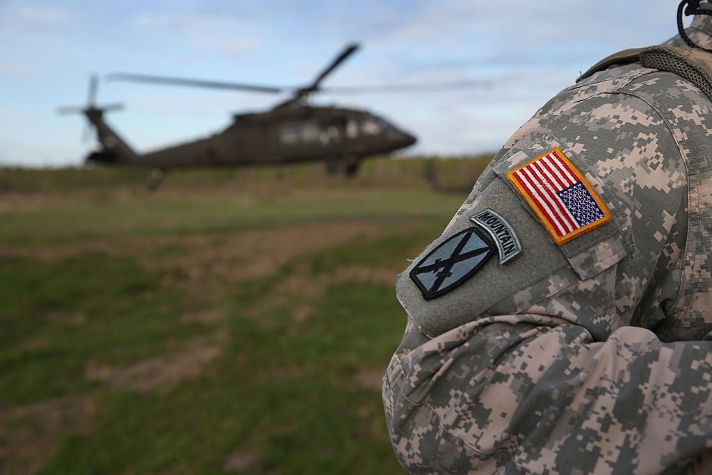 u.s. army soldier and helicopter