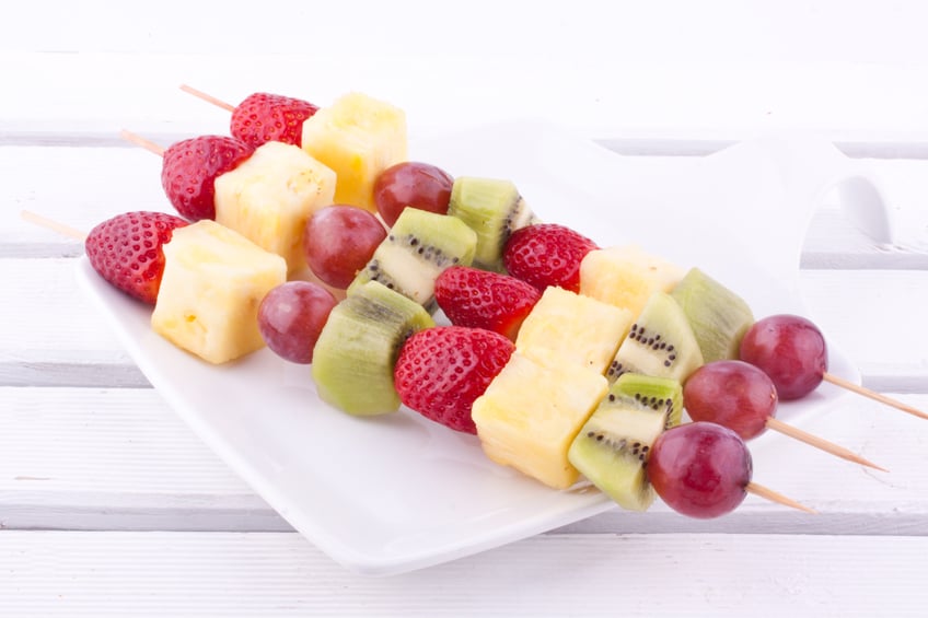 three fruit skewer in white plate