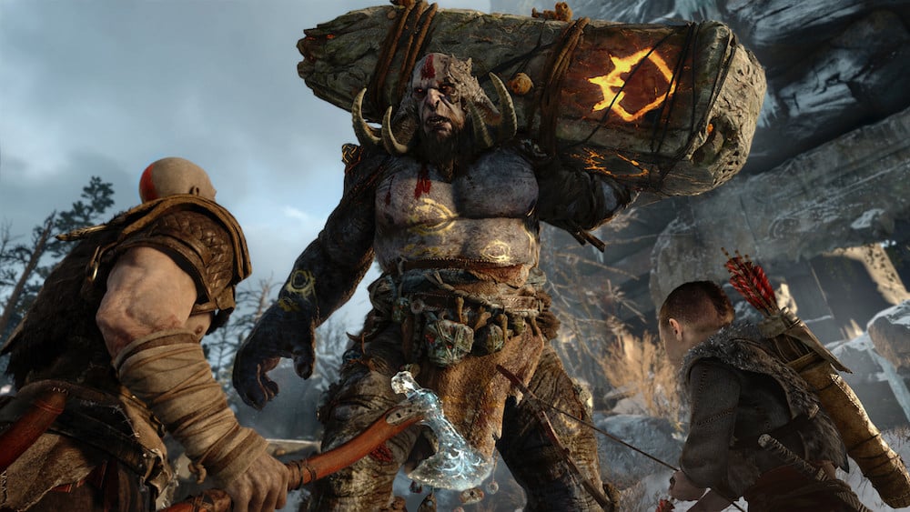 Kratos and his son confront a giant in God of War for PS4.