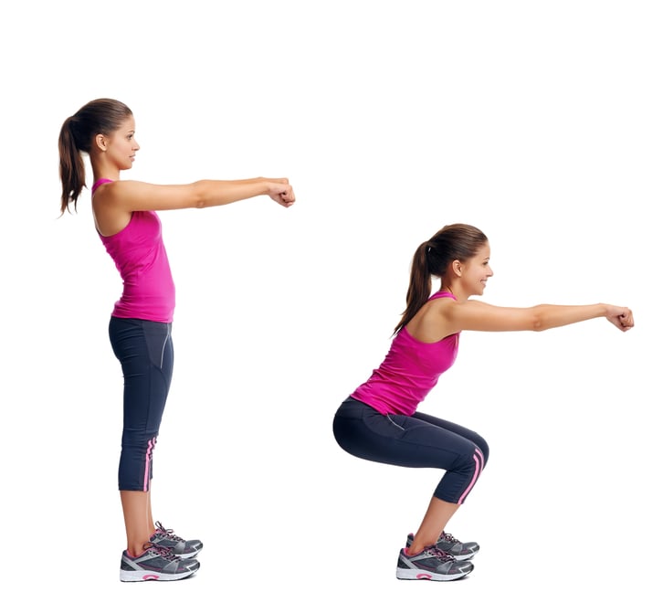 A woman performing a basic squat