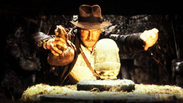 Indiana Jones is getting ready to make a switch in a cave.