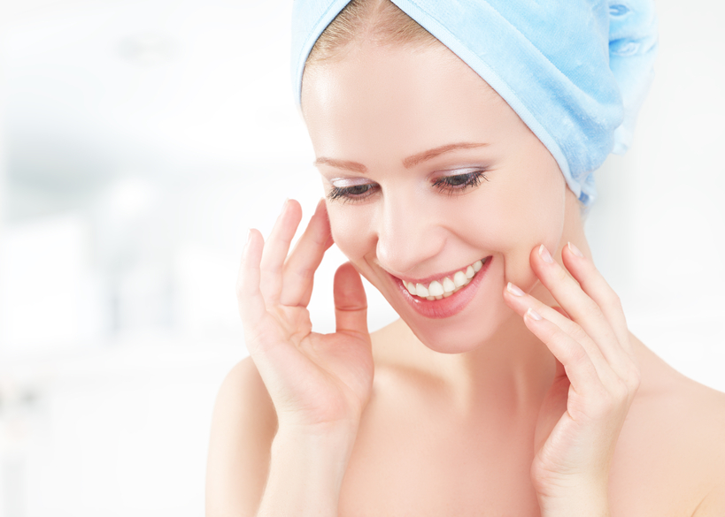 young woman with clear complexion in the bathroom