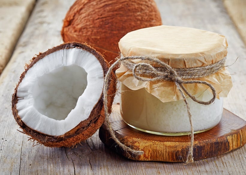 jar of coconut oil and fresh coconuts jar of coconut oil and fresh coconuts