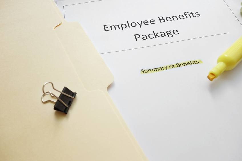 Employee benefits documents shown with a highlighter