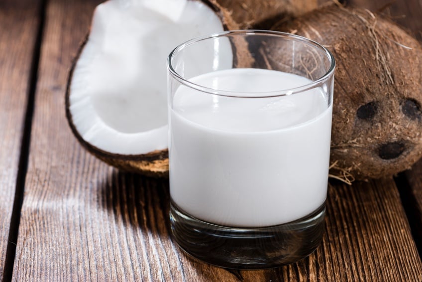 Coconut Milk in a glass with coconut