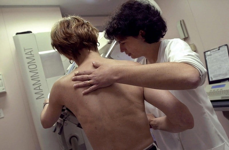 A nurse performs a mammography A nurse performs a mammography