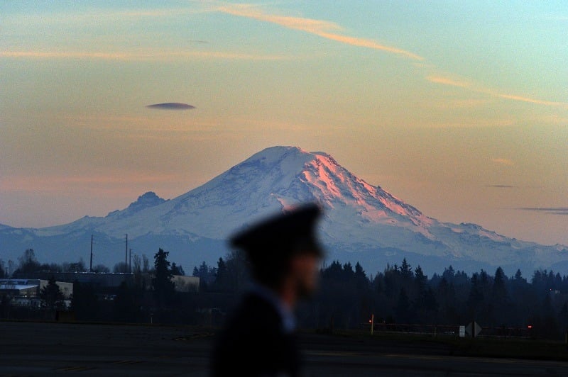 Air Force personnel man position as Mount Rainier looms near Tacoma, Washington
