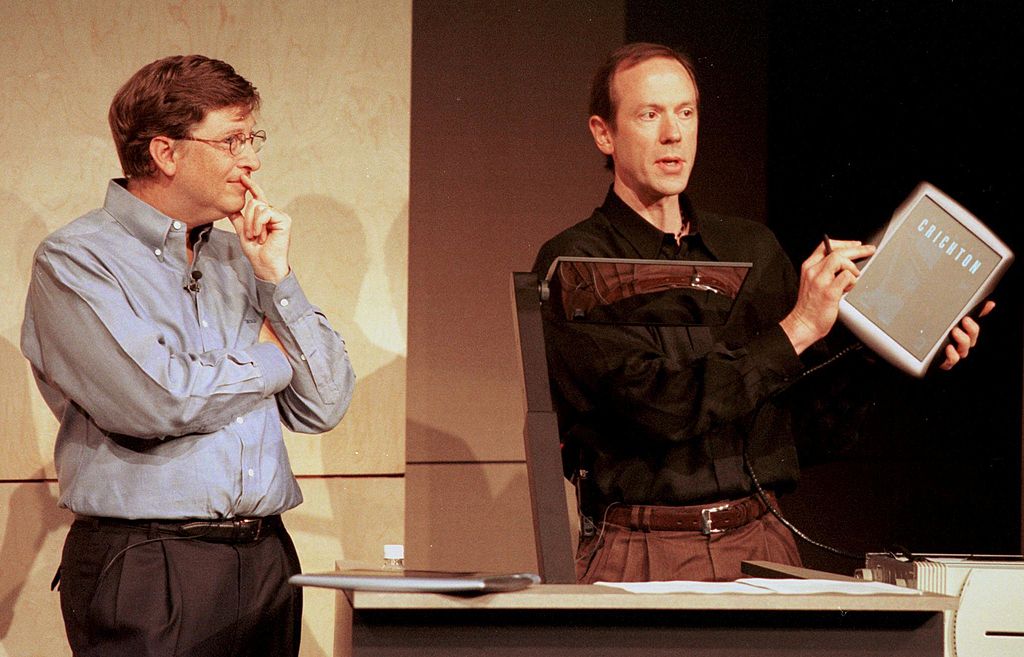 Bill Gates watches a demonstration of the Tablet PC by colleague Bert Kelly at Forum 2000 in Redmond, Washington in June of 2000