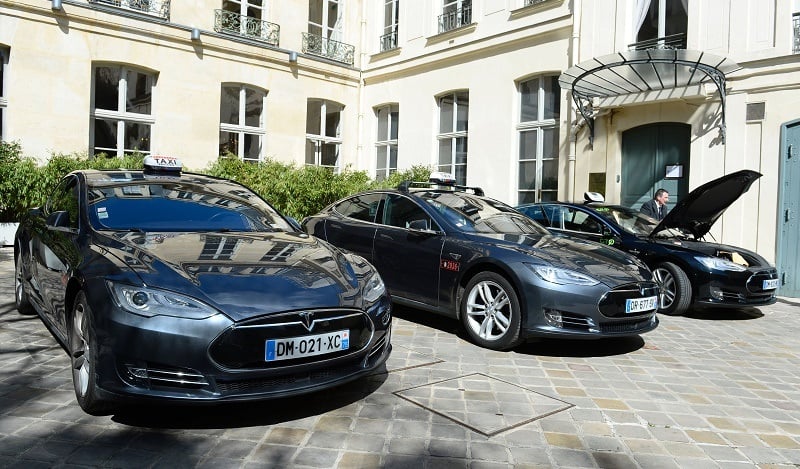 Electric Tesla taxis are presented during the launch of the initiative Taxis4SmartCities in Paris on April 14, 2016.
