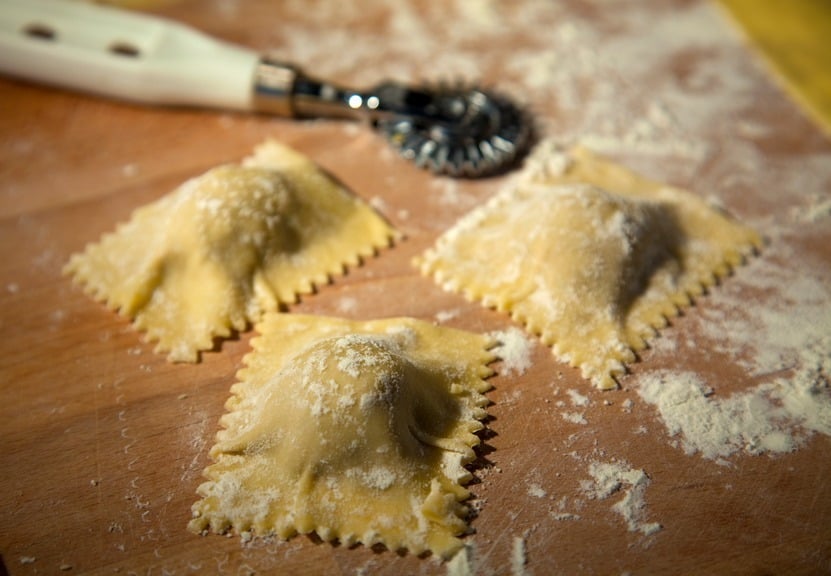 Homemade ravioli being cut