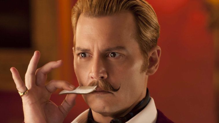 Johnny Depp combs his mustache in Mortdecai