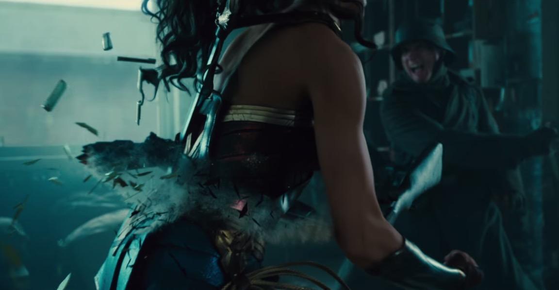 Wonder Woman breaks a rifle across her back