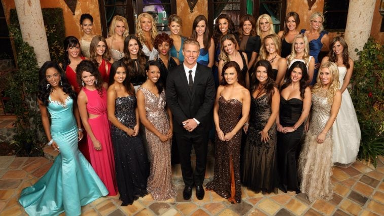 Contestants on 'The Bachelor' posing together in front of the house. 