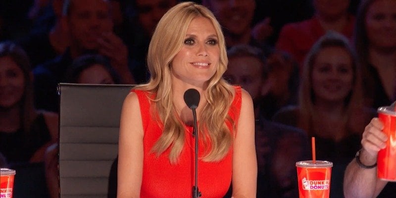 Heidi Klum wears a red dress while serving as a judge at America's Got Talent.