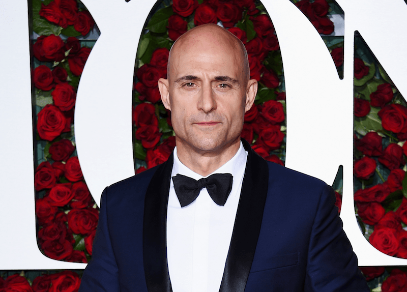 Mark Strong poses in a tux at a red carpet event