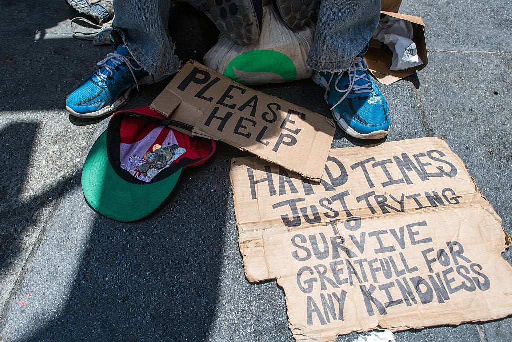Homeless man panhandling