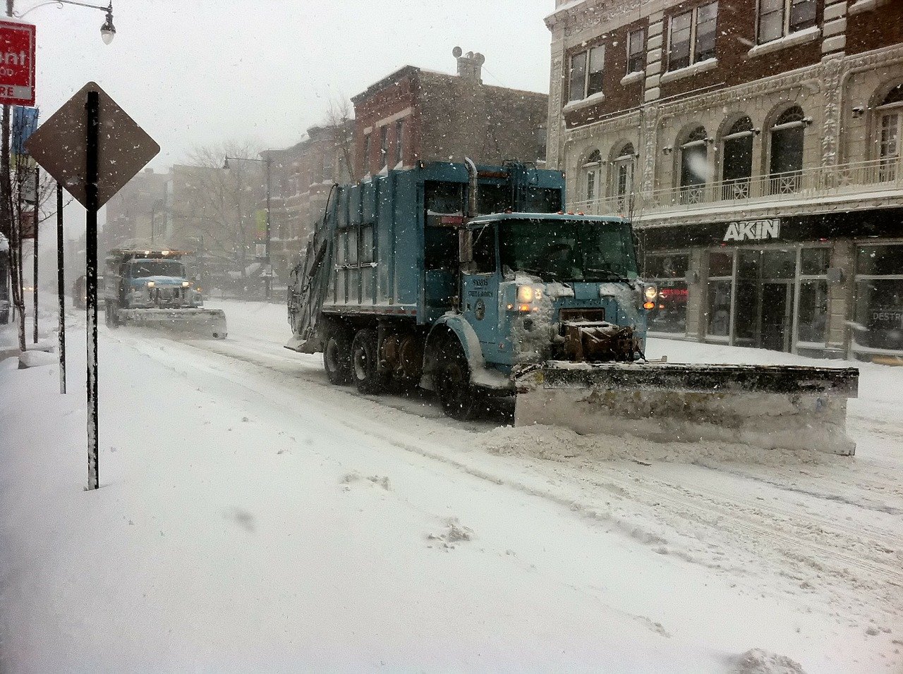 Snowplow on Chicago streets in blizzard