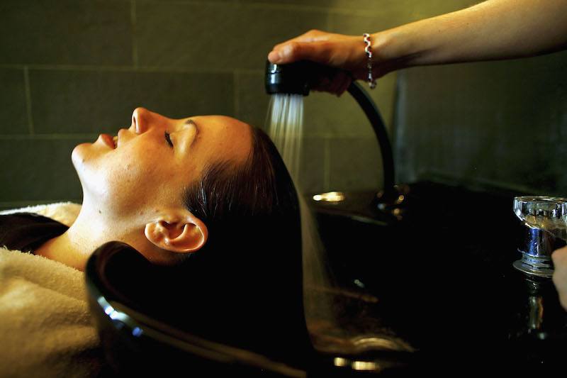 A Hari's salon employee has her hair rinsed after application of the bull semen and katera treatment at Hari's Salon on February 6, 2007 in London, England. A new, alternative and intense conditioning treatment at a Chelsea hair salon, Hari?s uses organic pedigree Angus bull semen, fresh from Brooklet Farm in Cheshire. The substance?s pure protein, combined with katera, a protein-rich plant root, penetrates each shaft and deeply nourishes the hair.
