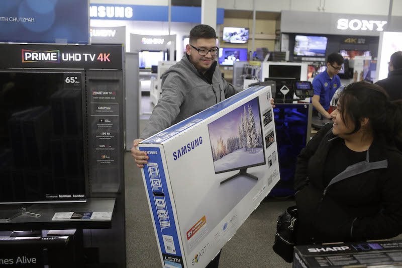 person holding a television