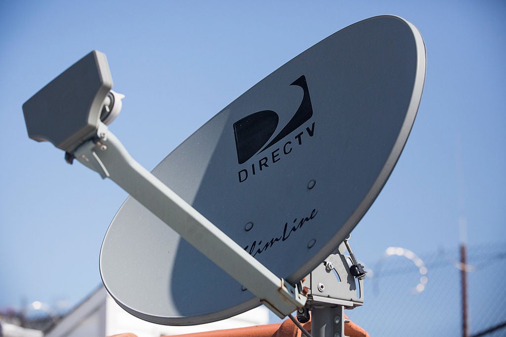 A DirecTV sattelite dish sits on a roof