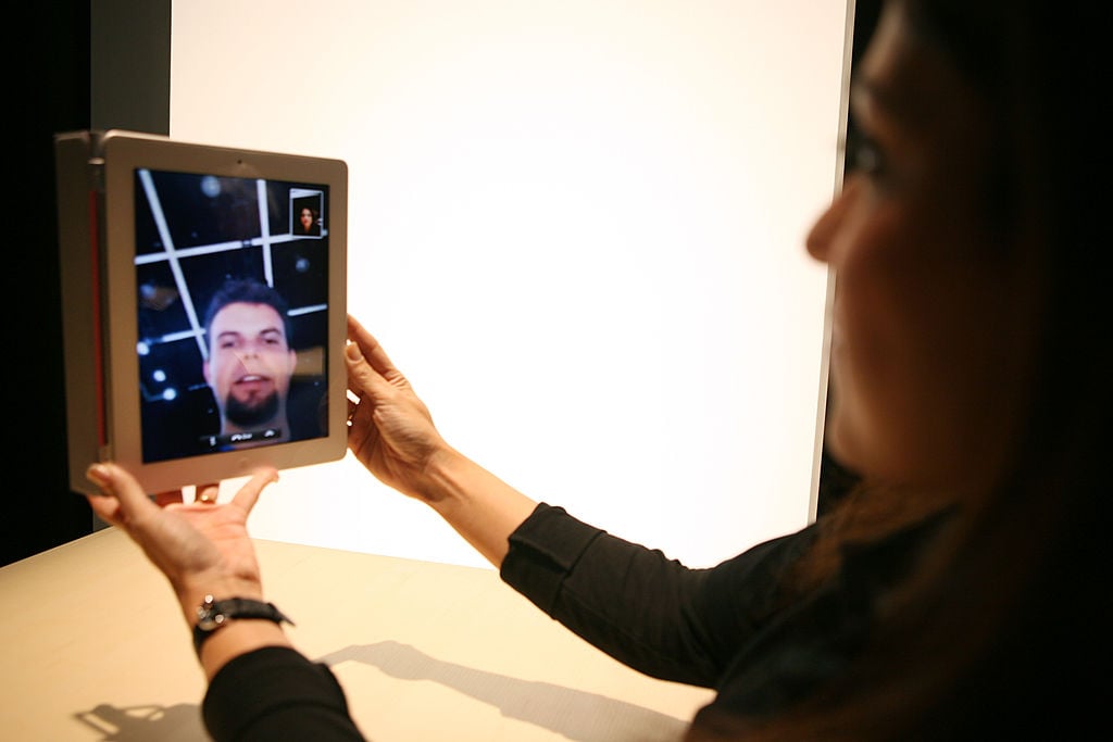 An Apple representative demonstrates the video chat feature