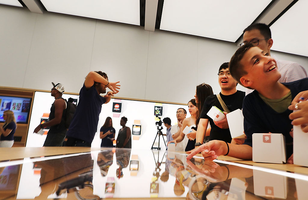 Customers shop at the new Apple Store at the 350,000 square-foot World Trade Center