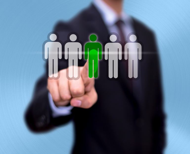 Businessman hand pointing at a figure