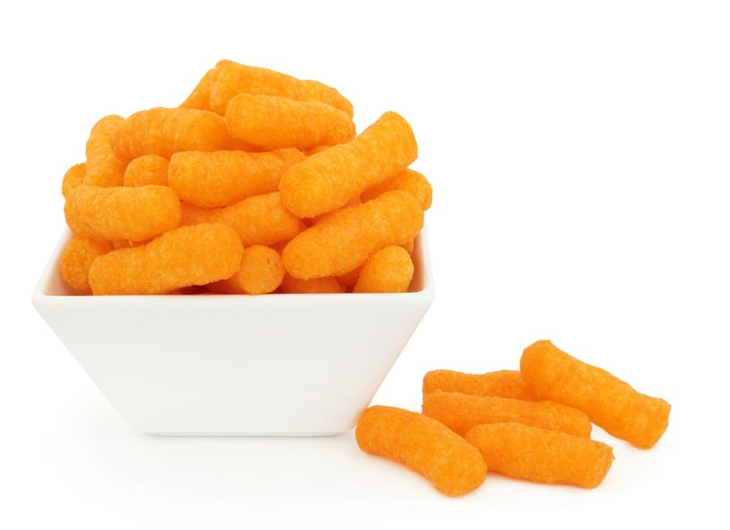 Cheese puff snacks in a porcelain dish