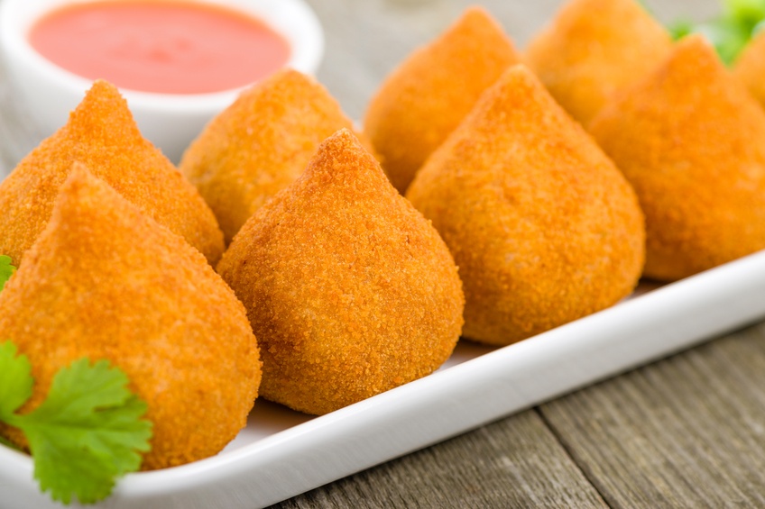 Coxinha de Galinha on a wooden table