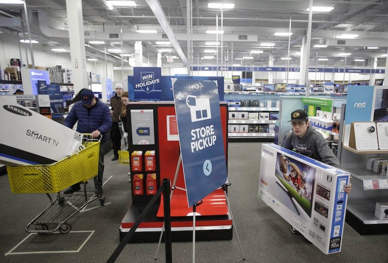 Customers shop for electronics at Best Buy