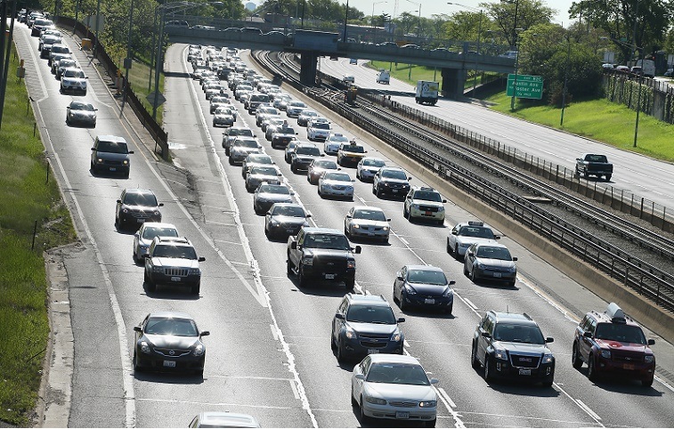 Traffic jams up on the Kennedy Expressway leaving the city while inbound traffic remains light as motorists hit the road for the start of the Memorial Day weekend on May 23, 2014 in Chicago, Illinois. AAA forecasts the number of drivers taking to the roads for the holiday will hit a 10-year record. The motor club expects roughly eight in ten Americans to take a road trip during the long weekend.