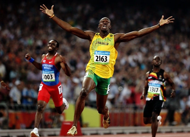 Usain Bolt of Jamaica reacts after breaking a world record thanks to a disciplined post workout routine, which included muscle recovery practices