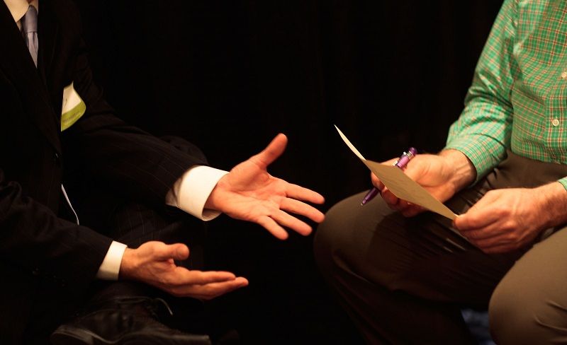 A job recruiter from one of several staffing agencies interviews a candidate
