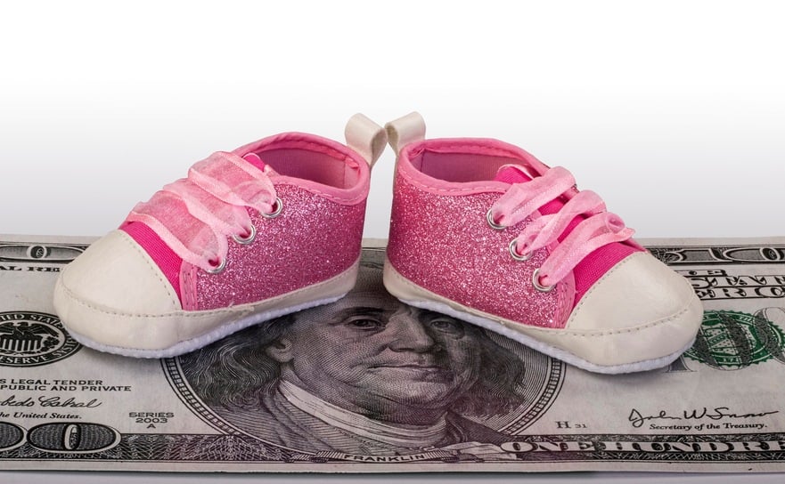 baby shoes on $100 bill