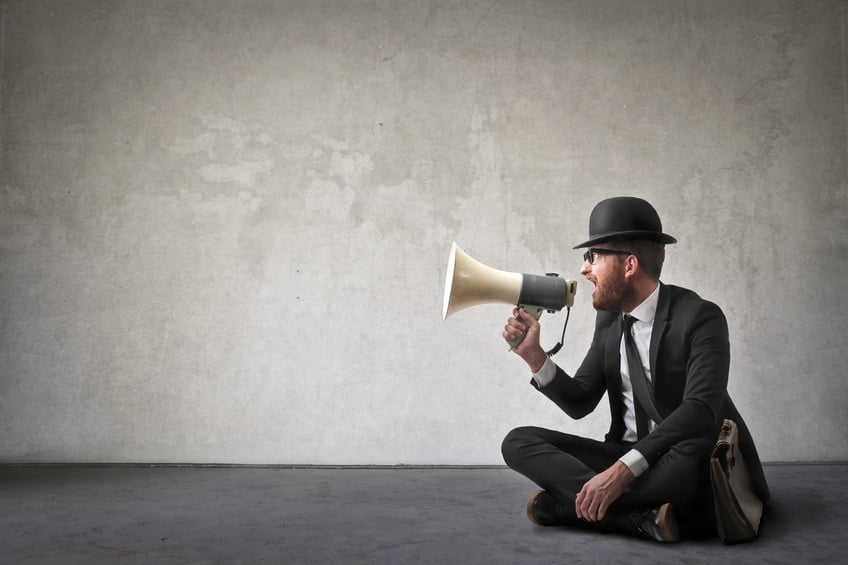 man shouting with a megaphone