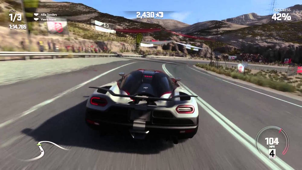 A car races along a track