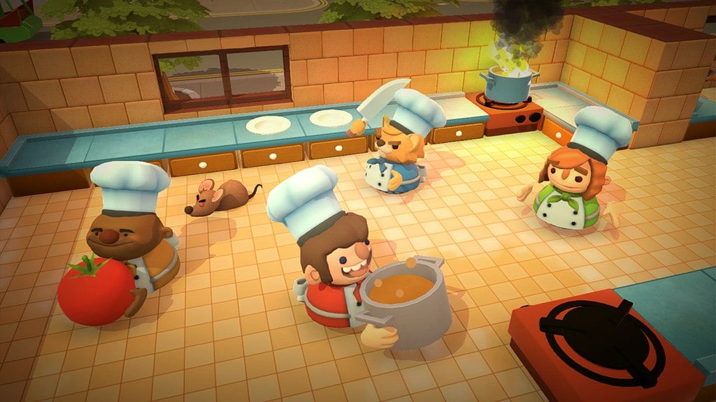 Chefs working madly to make dishes.