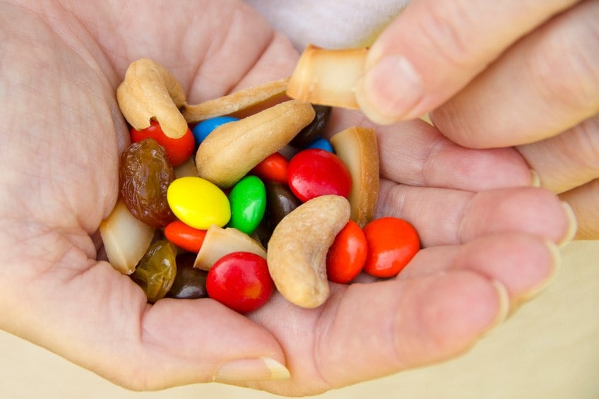 Eating trail mix from hand