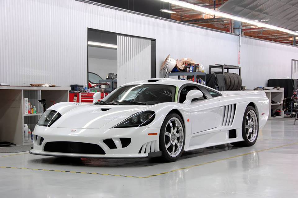 A Saleen S7 sits in a workshop