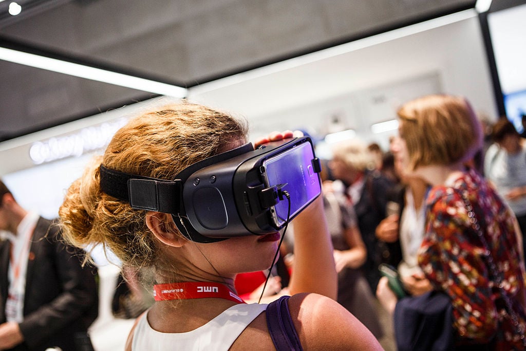 A visitor tries out virtual reality from Samsung at the 2016 IFA consumer electronics trade fair