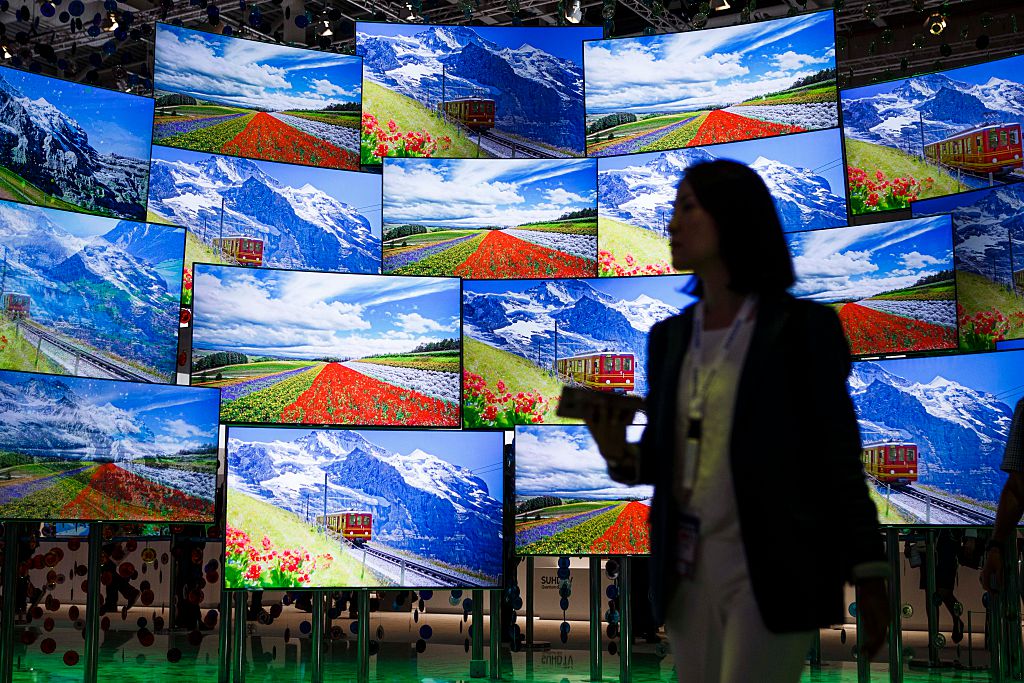 A visitor passing the display wall from Samsung at the 2016 IFA