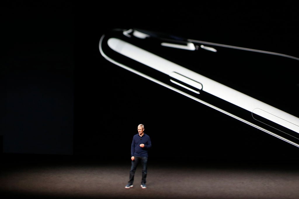 Apple CEO Tim Cook speaks on stage during a launch event