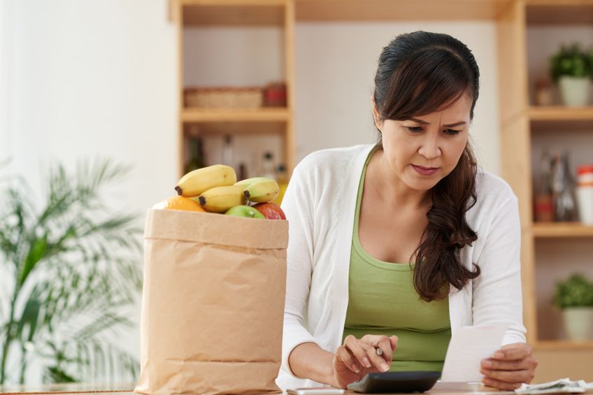 A woman looking over her bills