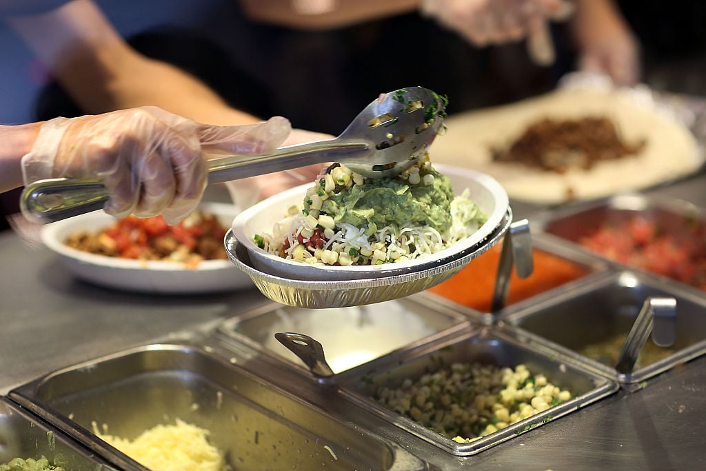 Chipotle restaurant workers fill orders for customers