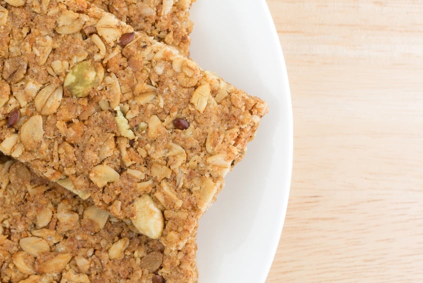 granola bars on a white plate cinnamon flavored sesame and pumpkin seed granola
