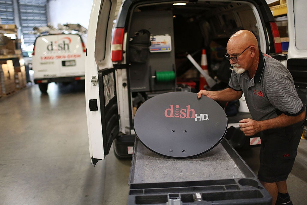 Alberto Rodriguez a Dish Network technician restocks his truck on June 4, 2015 in Miami, Florida