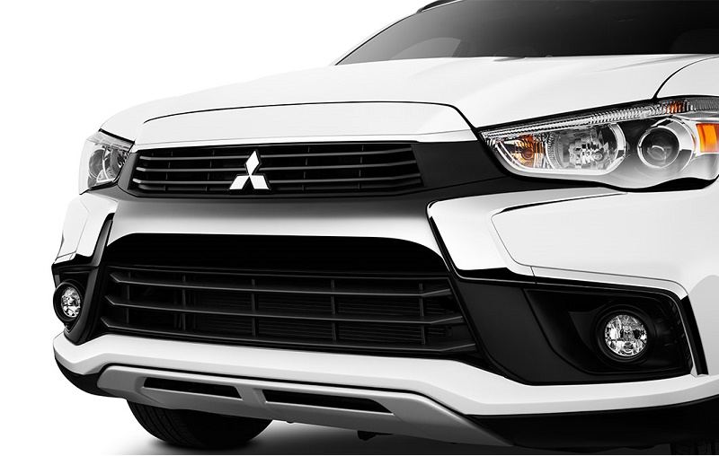 Close-up view of white 2016 Outlander Sport grille