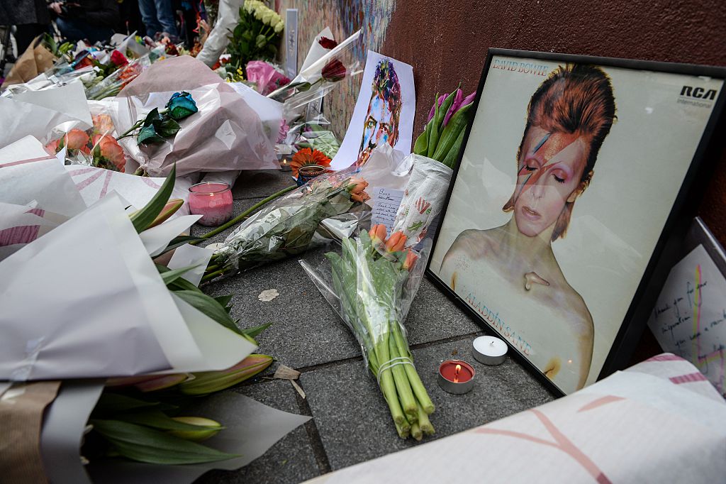 Tributes to David Bowie's memorial in the form of flowers and photos