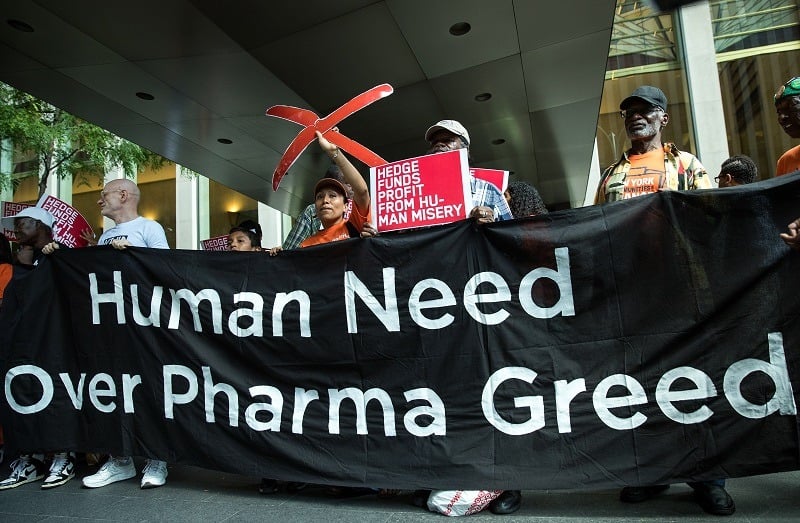 Activists rally during a protest against the price of prescription drugs
